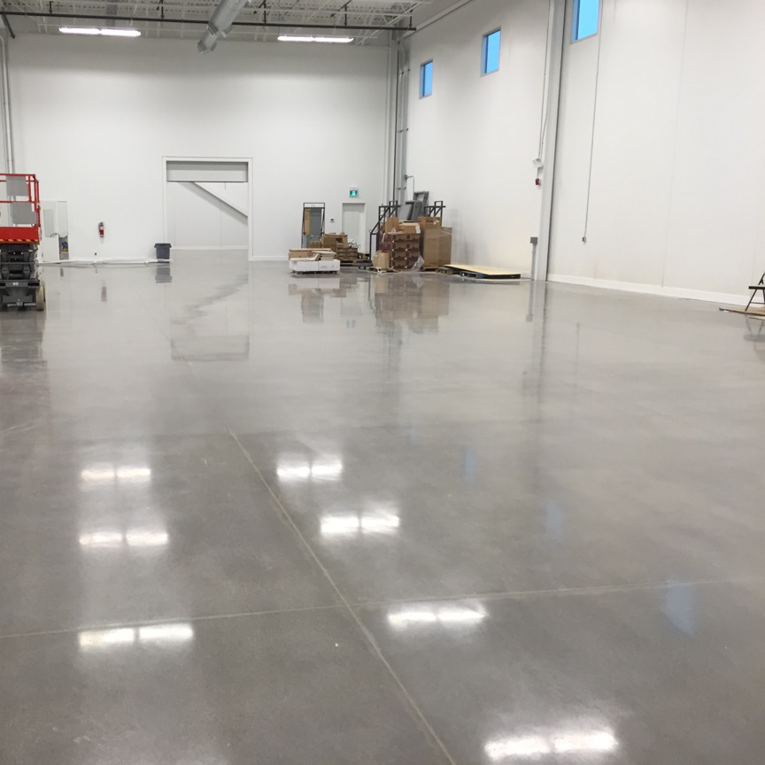 a polished concrete mid grey floor in a warehous